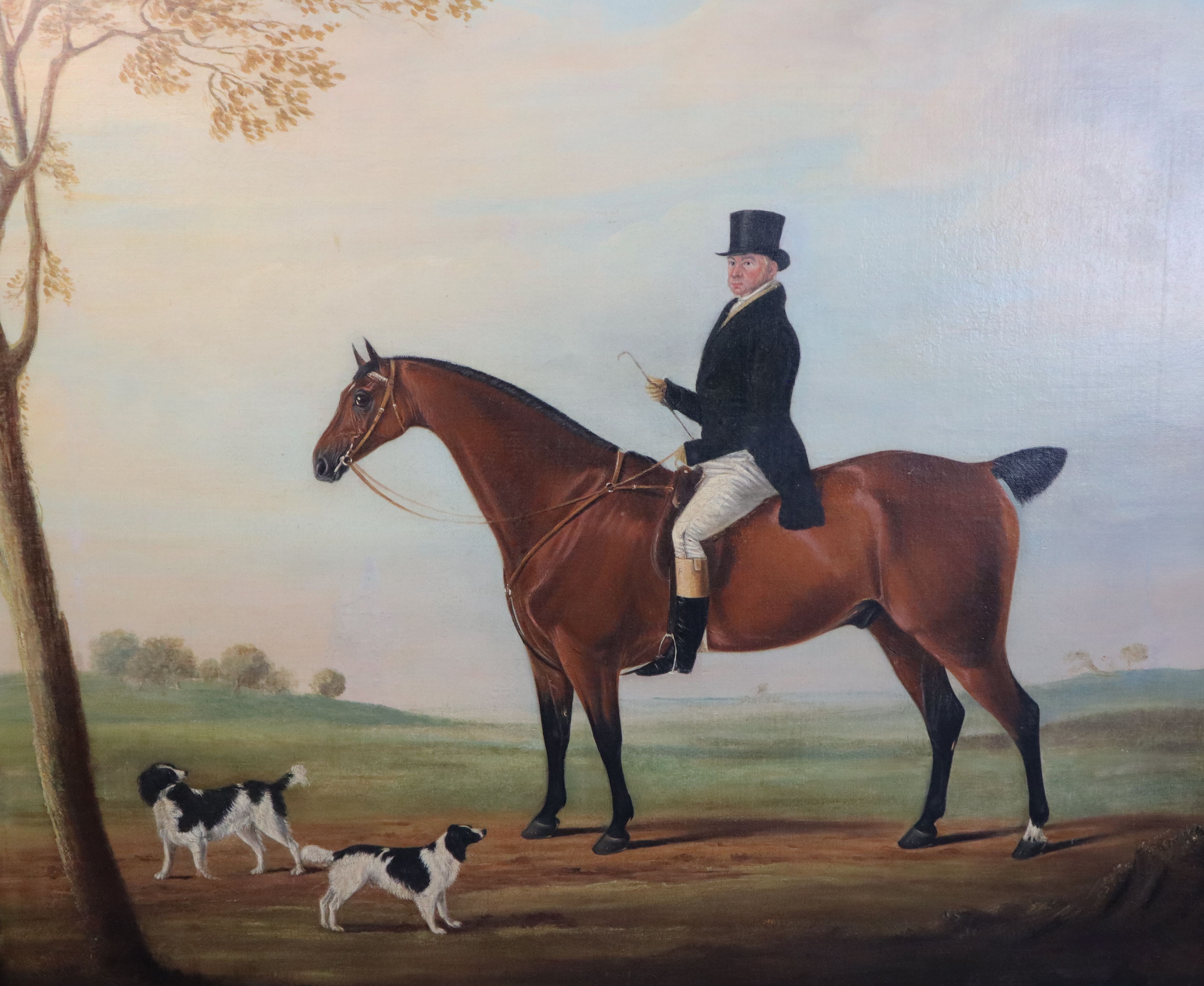 Follower of James Loden of Bath (1784-1854) Portrait of a gentleman on a bay hunter with two spaniels in a landscape 28.5 x 35.5in.